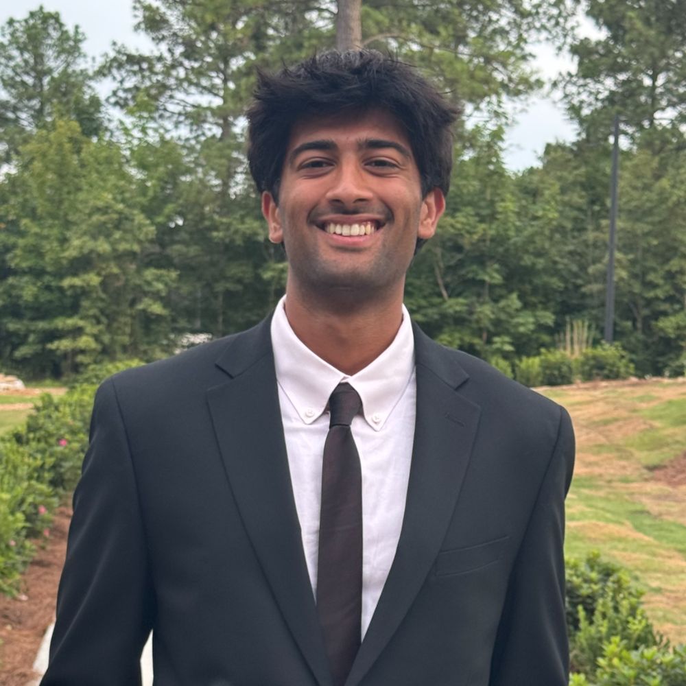 I am Aashish Dhanani. I am wearing a black jacket.